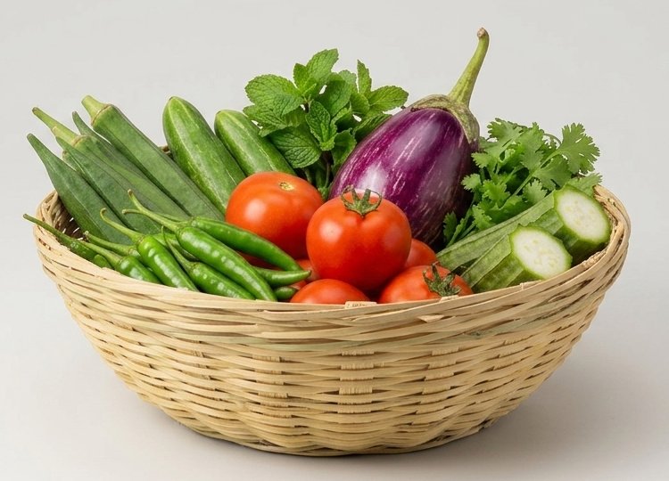 A weekly RAKSS vegetable basket — okra, cucumber, mint, brinjal, coriander, tomatoes and green chillies